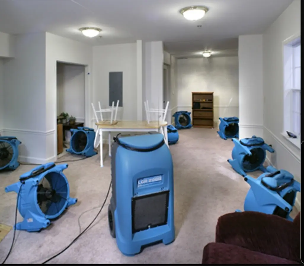 Air movers and dehumidifier setup for Water Extraction & Removal in Kermit